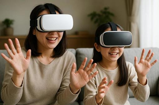 自宅でVR体験を楽しむ母と娘の平和な風景 自宅でVR体験を楽しむ母と娘の平和な風景の写真
