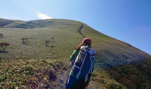 Woman climbing a mountain Woman climbing a mountain