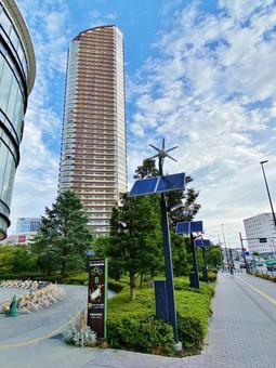 High-rise apartment building and solar panels, JPG