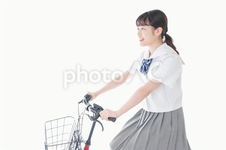 自転車通学をする若い女子学生 白バック,運転ルール,変速ギアの写真素材