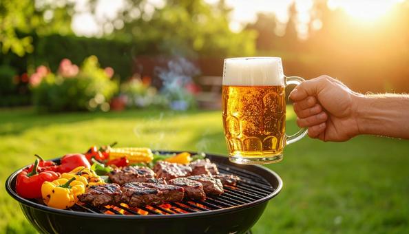 ビールで乾杯するバーベキュー ビールで乾杯するバーベキューの写真