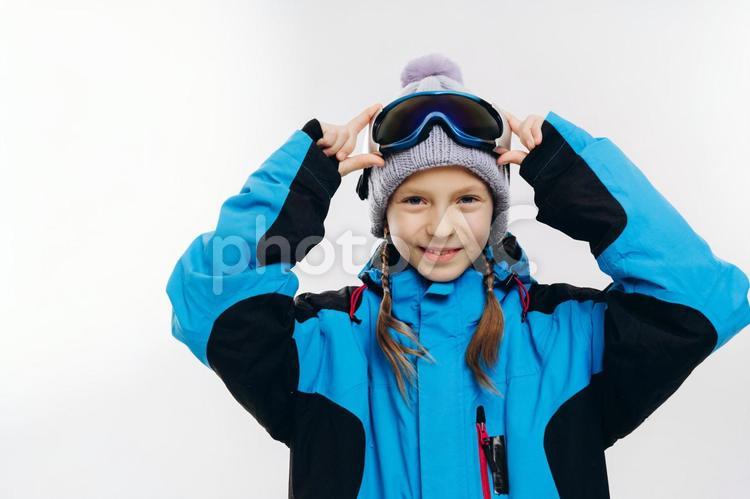 スノーボードウェアを着た笑顔の女の子 冬,スポーツ,ウィンタースポーツの写真素材