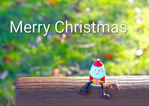 丸太に乗って、メリークリスマス！ クリスマス,サンタクロース,英文字の写真素材
