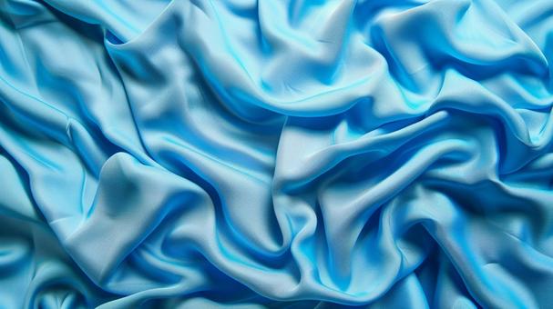青い布のシワと光沢テクスチャ背景の写真