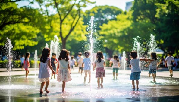 公園の噴水で水遊びする夏の日本人の子供 公園の噴水で水遊びする夏の日本人の子供の写真