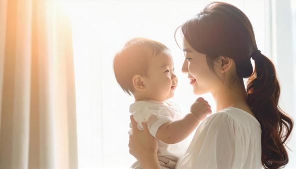 見つめ合う母親と赤ちゃん 見つめ合う母親と赤ちゃんの写真