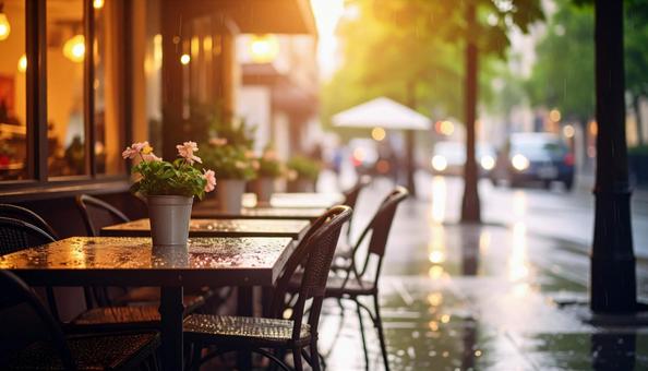 夕暮れの光に照らされる雨のカフェ 夕暮れの光に照らされる雨のカフェの写真
