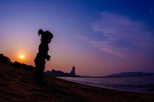 Children playing in the sea at sunset, JPG