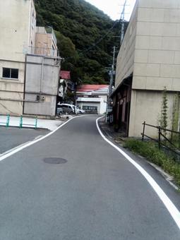 あるまちなみ 町並み,道路,山の写真素材