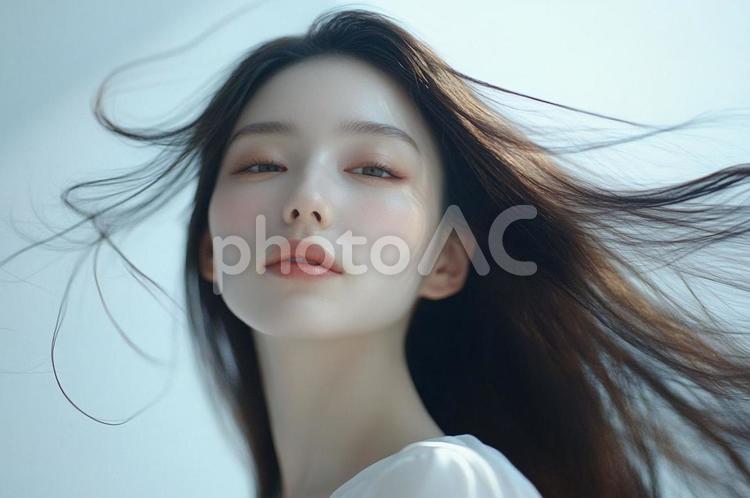 女性 髪が靡いている写真※AI生成 女性,1人,髪の写真素材