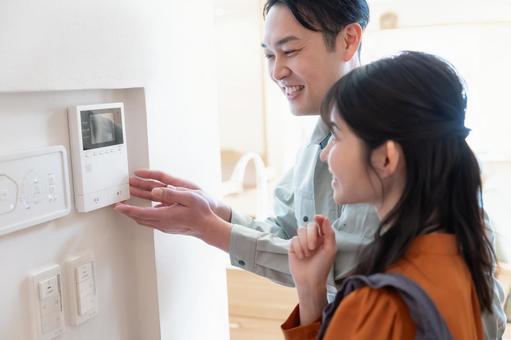 Contractor checking the intercom, JPG Contractor checking the intercom, JPG