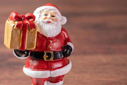 サンタ人形と金色プレゼント サンタクロース,人形,置物の写真素材
