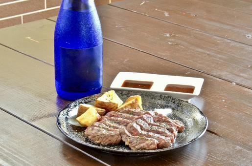 ステーキ ステーキ ステーキ,肉,酒の写真素材