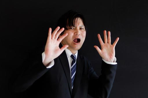 驚くビジネスマンの表情 驚くビジネスマンの表情の写真