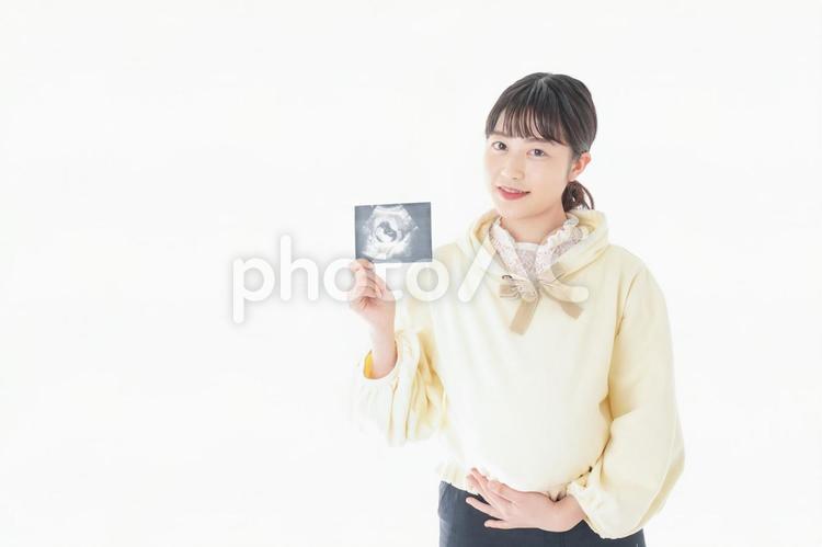 エコー画像を持つ若い妊婦の女性 ヘルスケア,教育,看護師の写真素材