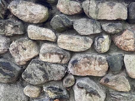 湿った石垣のテクスチャ｜古い石壁自然素材 石垣,石壁,自然石の写真素材