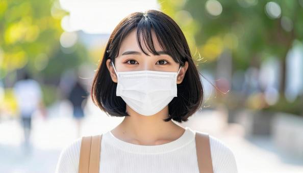 マスクをつける人 マスクをつける人の写真