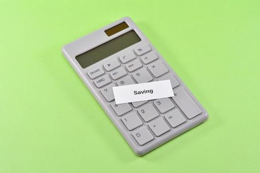 savingと電卓で節約のイメージ savingと電卓で節約のイメージ saving,節約,家計の写真素材