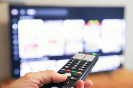 Hand turning on the TV with a remote control, tv set, remote controller, video, JPG