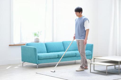 カーペットの掃除をする男性 男性,カーペットクリーナー,掃除の写真素材