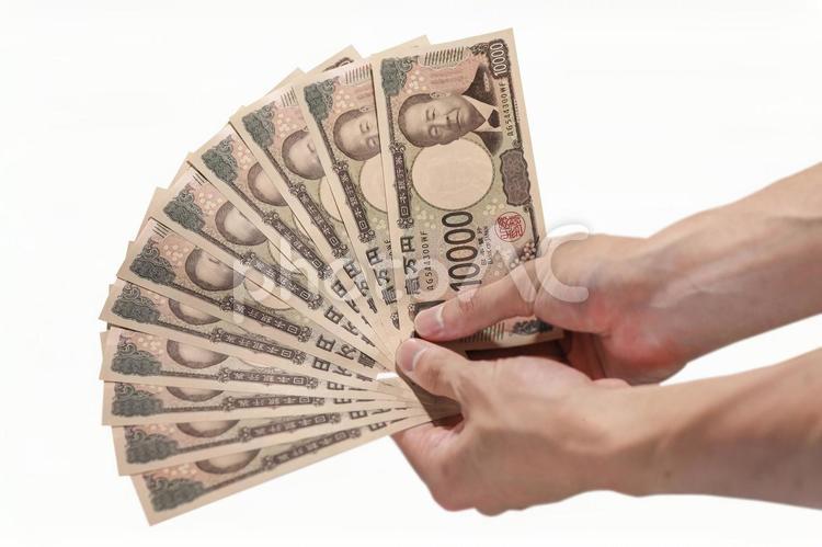 一万円札を10枚持っている手 新紙幣,十万円,数えるの写真素材