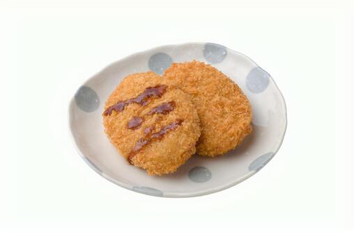 ソースがかかった２枚のコロッケ コロッケ,食べ物,揚げ物の写真素材