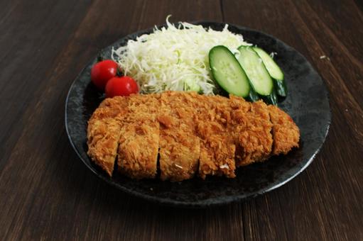 とんかつと野菜の定食 とんかつと野菜の定食の写真