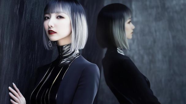 黒いドレスを着たボブヘアーの魅惑的な女性の写真