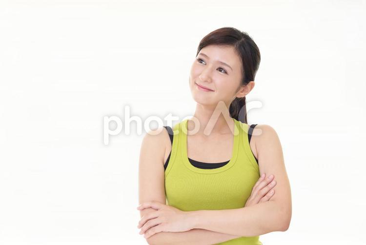 タンクトップを着た笑顔の女性 女性,ダイエット,主婦の写真素材