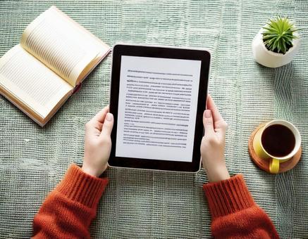Reading a book on an e-reader, e-book, tablet, ipad, JPG