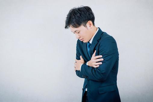 風邪を引いて寒気がある会社員男性 風邪,体調不良,インフルエンザの写真素材
