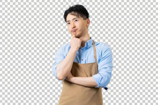 考えるエプロン姿の男性 背景透過PSD 男性,人物,エプロンの写真素材