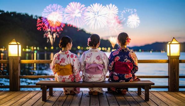 打ち上げ花火と浴衣姿の女性 打ち上げ花火と浴衣姿の女性の写真