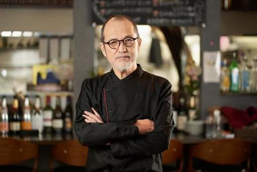 Asian man working in a restaurant Asian man working in a restaurant