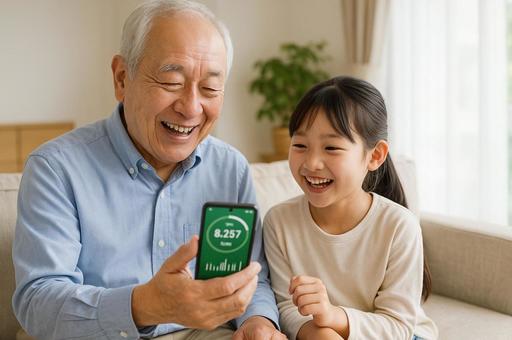高齢者と孫の健康アプリ利用の写真