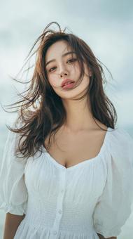 感情を秘めた眼差し:白いドレスの若い女性 感情を秘めた眼差し:白いドレスの若い女性の写真