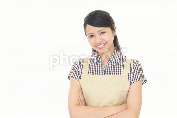 エプロンを着た笑顔の女性 女性,女,主婦の写真素材