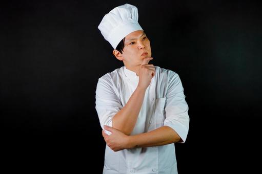 考えるシェフの姿 考えるシェフの姿 シェフ,料理人,白衣の写真素材