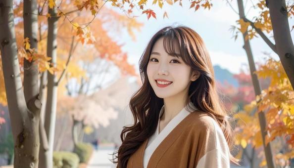 秋の背景に立つ日本人女性 秋の背景に立つ日本人女性の写真