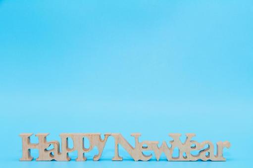 水色背景にHappy New Year ハッピーニューイヤー,新年,正月の写真素材