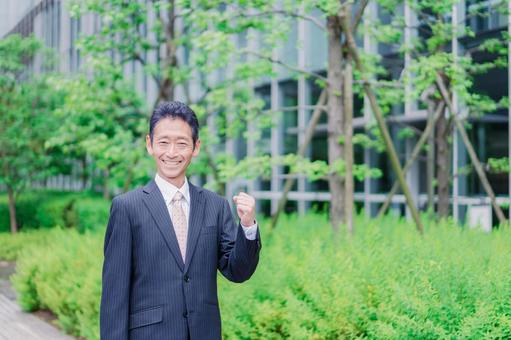 Elderly businessman doing a fist pump, JPG