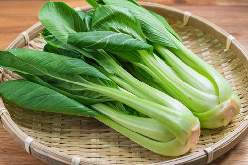 Bok choy arranged on a bamboo basket, JPG