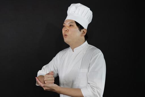 納得するシェフ 納得するシェフの写真
