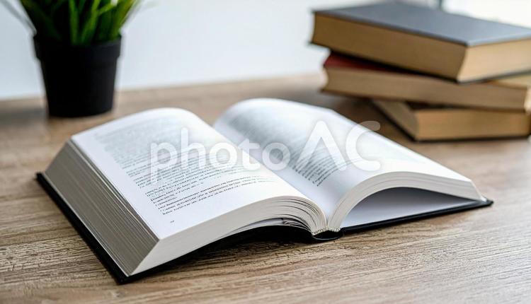 読書イメージ　見開きと積み重なる本 読書,本,ブックの写真素材