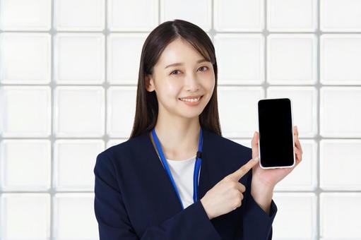 A woman in a suit pointing at the screen of a smartphone, akıllı telefon, kadın, e-mail, JPG