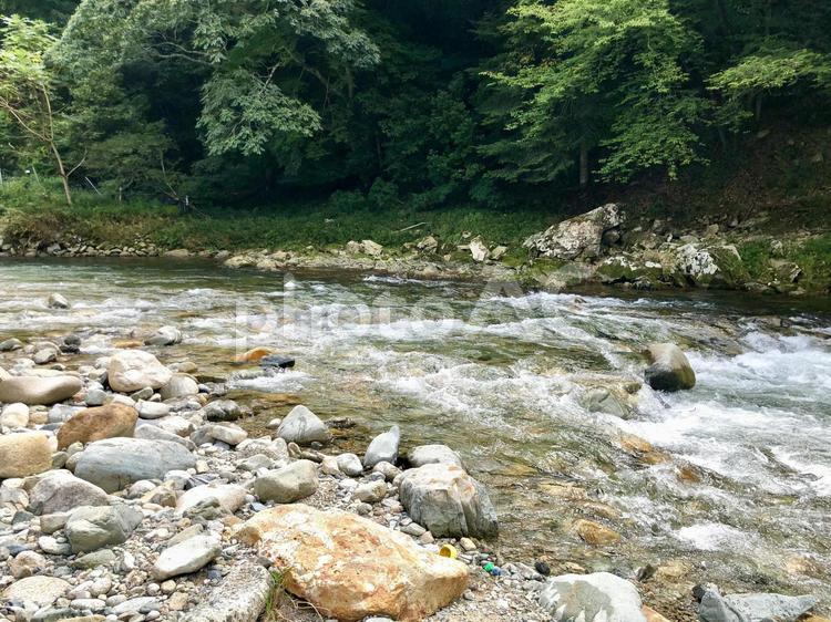 川の水しぶきと山 山,川,青空の写真素材