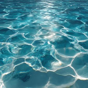 水色の水面に広がる、幻想的な光の波紋 水色の水面に広がる、幻想的な光の波紋の写真