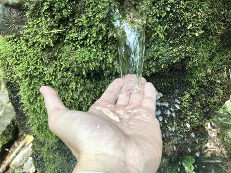 Image of scooping spring water with hands, JPG Image of scooping spring water with hands, JPG