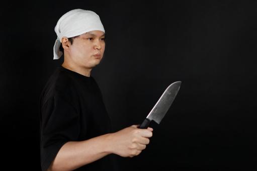 包丁を持つ料理人の男性 包丁を持つ料理人の男性の写真