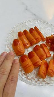 ハロウィンパーティーの家ごはん縦向き にんじん,グラッセ,料理の写真素材